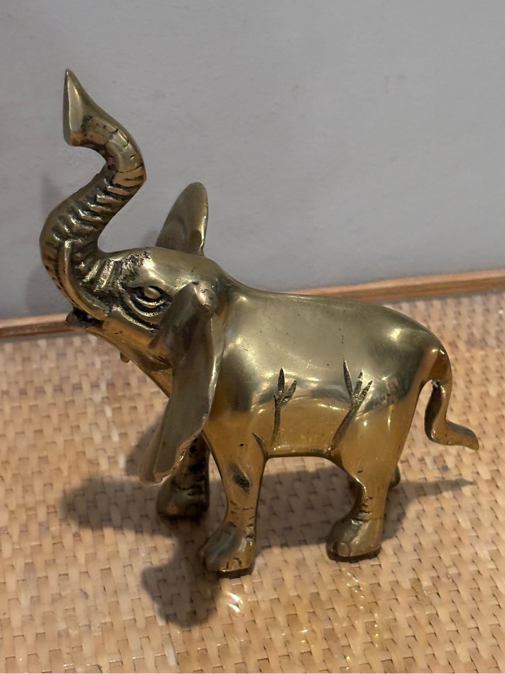 Vintage solid brass elephant figurine with its trunk raised upward!